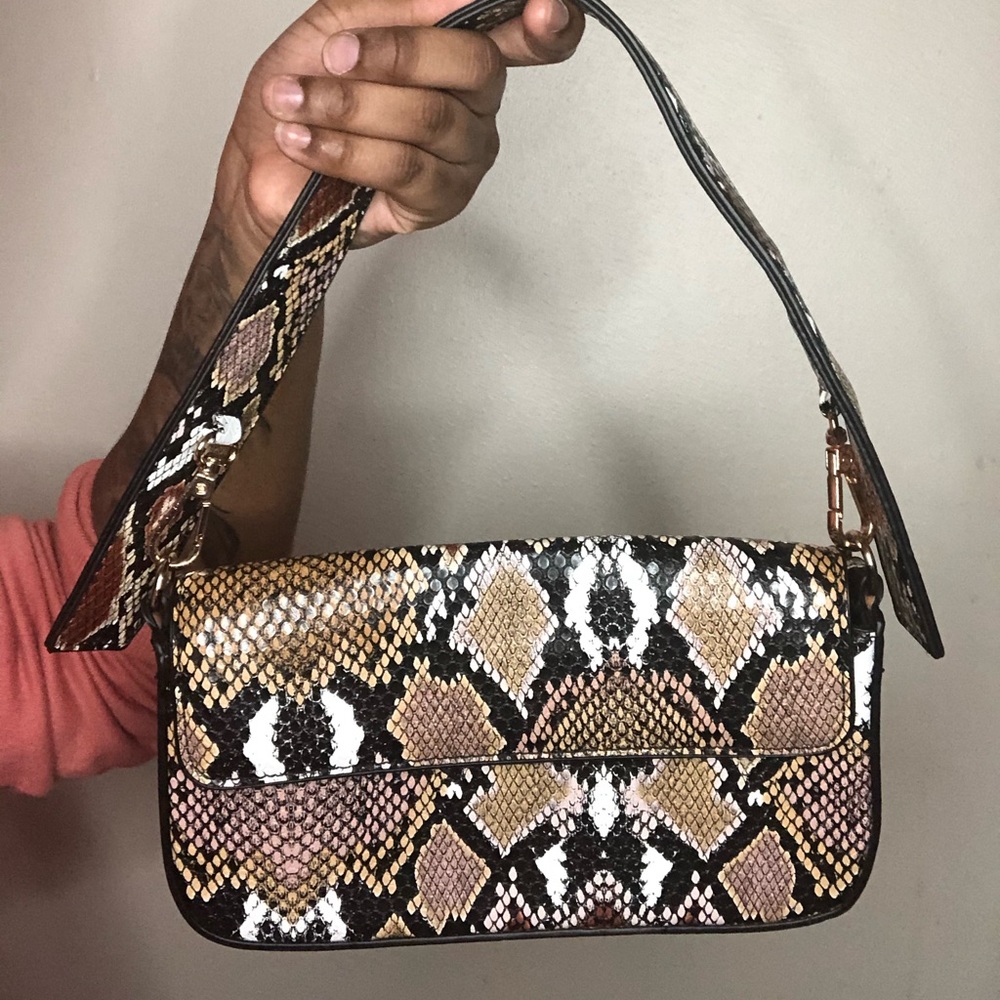 printed purse with two straps, long and short.
